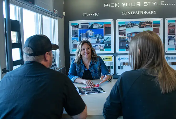 A sales representative from Leduc Overhead Door Inc. showing options of Garaga garage doors